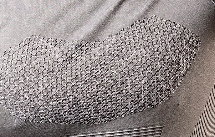 Gray textured compression shirt — knit-in chest texture close-up, not printed