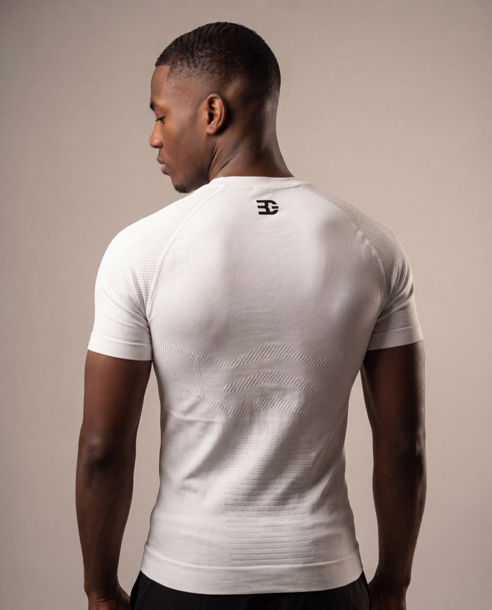White textured compression shirt — back logo